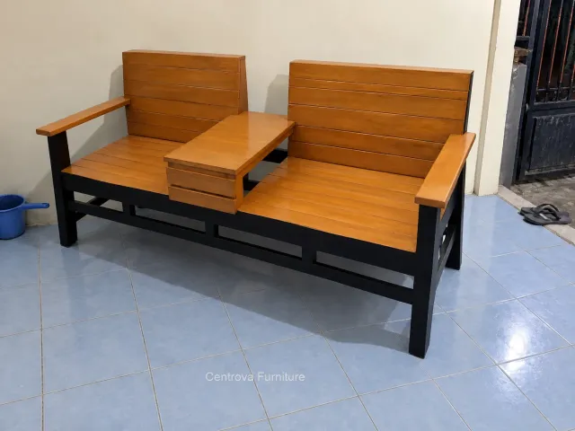 Two-seat bench with an integrated centre table on a simple home terrace.